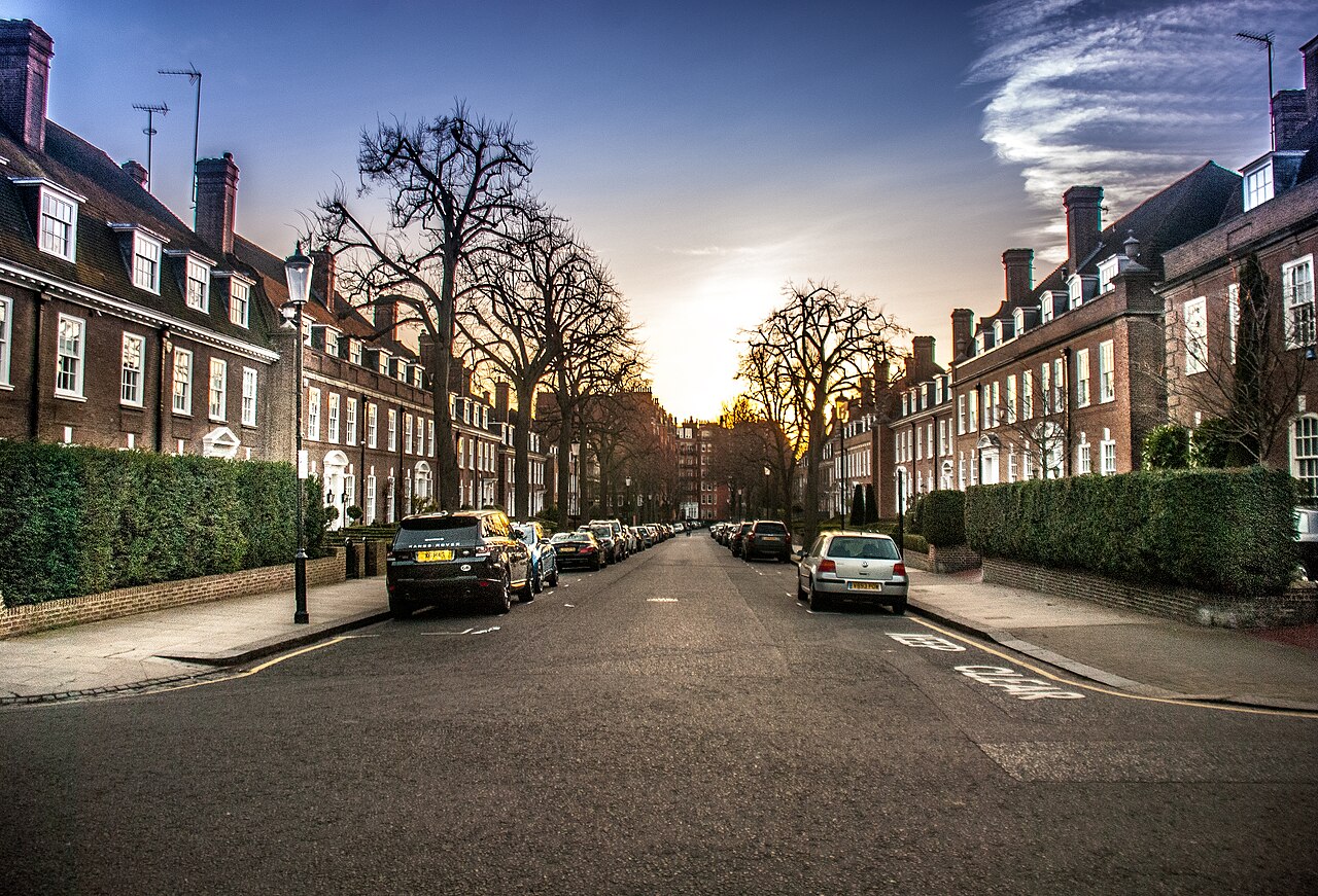 Traditional brick townhouses on a residential street in Kensington, London